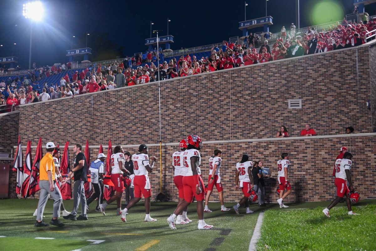 The NC State Football team exits in defeat as the Wolfpack cheers them on after the game against Duke at Wallace Wade Stadium on Saturday, Sept. 20, 2025. The Wolfpack scored a total of five touchdowns. NC State lost to Duke 45-33.