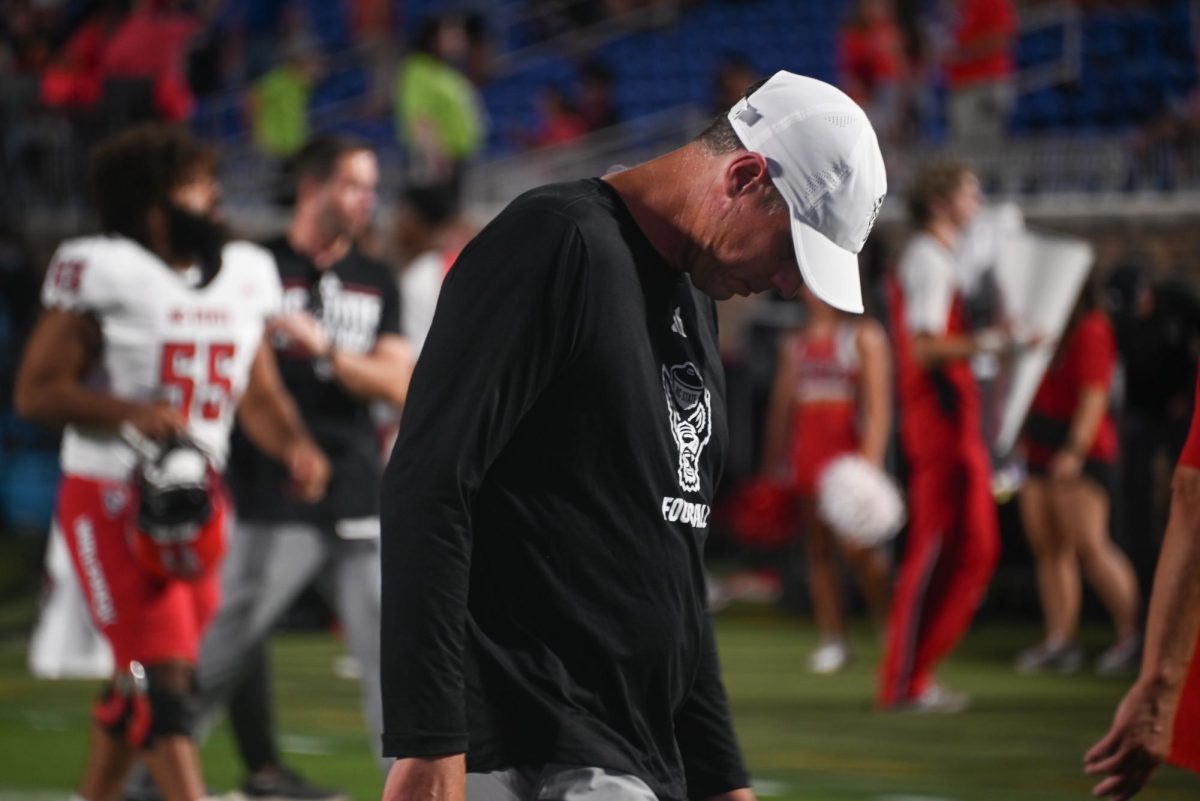 Running backs/special teams coordinator Todd Goebbel walks with disappointment after the game against Duke at Wallace Wade Stadium on Saturday, Sept. 20, 2025. NC State lost to Duke 45-33.