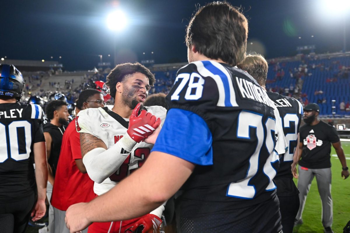 Redshirt-freshman wide receiver Christian Zachary shakes hands with a Duke player after the game against Duke at Wallace Wade Stadium on Saturday, Sept 20. 2025. NC State fell to Duke 45-33.