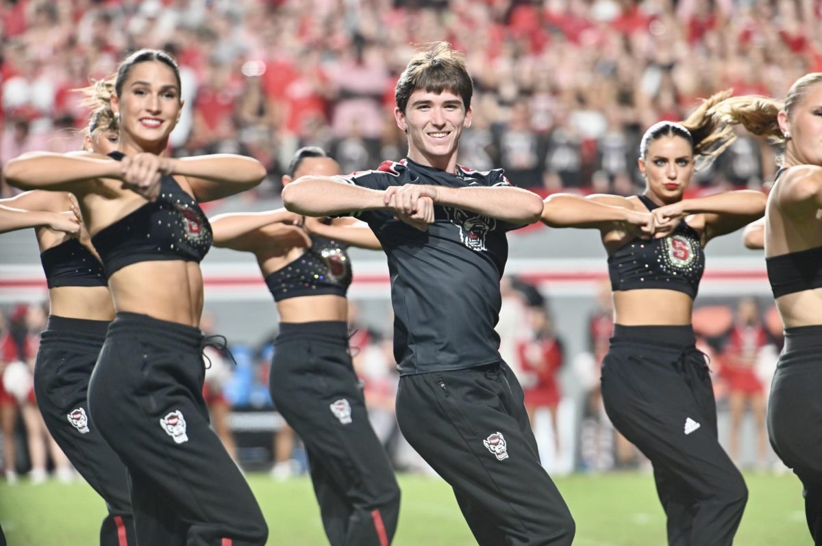 The NC State Dance Team performs on the field at the game against Virginia Tech at Carter-Finley Stadium on Saturday, Sept. 27, 2025. NC State lost the game 23-21.
