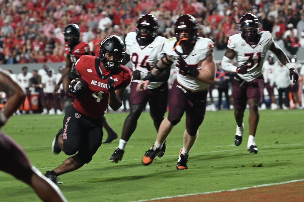 Redshirt freshman running back Jayden “Duke” Scott runs the ball during the game against Virginia Tech at Carter-Finley Stadium on Saturday, Sept. 27, 2025. Scott recorded one touchdown. NC State lost the game 23-21.