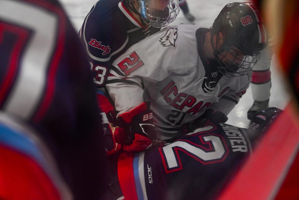 Senior forward Joey Gouveia holds down a Liberty player during the game against Liberty at Invisalign Arena on Friday, Sept 12, 2025. Icepack fell to Liberty 4-2.
