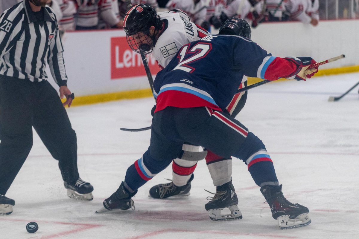 Sophomore forward Talon Langston fights for the puck after puck drop during the game against Liberty at Invisalign Arena on Friday, Sept 12, 2025. Icepack fell to Liberty 4-2.