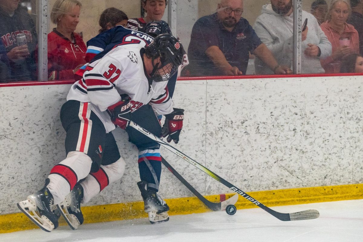 Sophomore forward Daniel Prazma fights for the puck during the game against Liberty at Invisalign Arena on Friday, Sept 12, 2025. Icepack fell to Liberty 4-2.