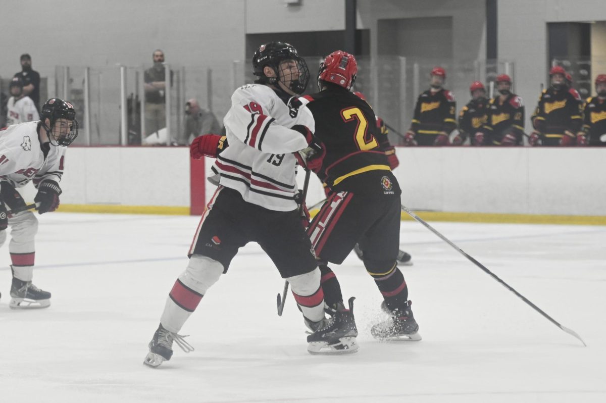 Freshman forward Jack Ammons checks an opponent during the game against Maryland at Invisalign Arena on Friday, Sept 26, 2025. NC State beat Maryland 4-1. 