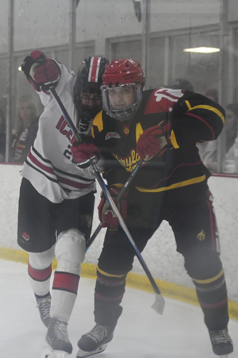 Sophomore forward Jake Gifford battles an opponent during the game against Maryland at Invisalign Arena on Friday, Sept 26, 2025. NC State beat Maryland 4-1. 