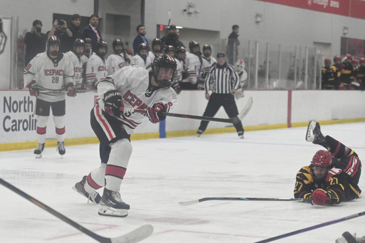 Freshman defenseman Patrick Maxwell shoots the puck during the game against Maryland at Invisalign Arena on Friday, Sept 26, 2025. NC State beat Maryland 4-1. 