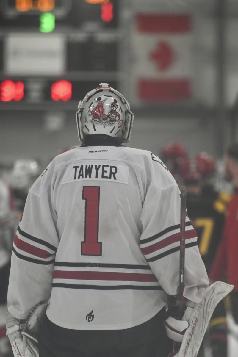 Senior goalie Isaac Tawyer admires the scoreboard during the game against Maryland at Invisalign Arena on Friday, Sept 26, 2025. NC State beat Maryland 4-1. 