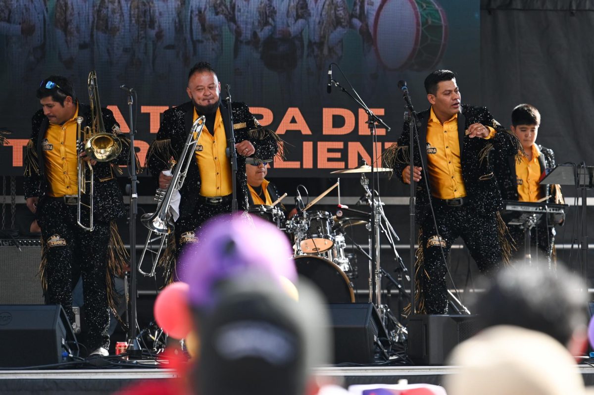 Regional Mexican band La Tropa de Tierra Caliente performs on stage during La Fiesta del Pueblo at Fayetteville Street Historic District on Sunday, Sept. 21, 2025. The event, which draws thousands annually, is organized by El Pueblo to celebrate the pride and resilience of the Latine community.