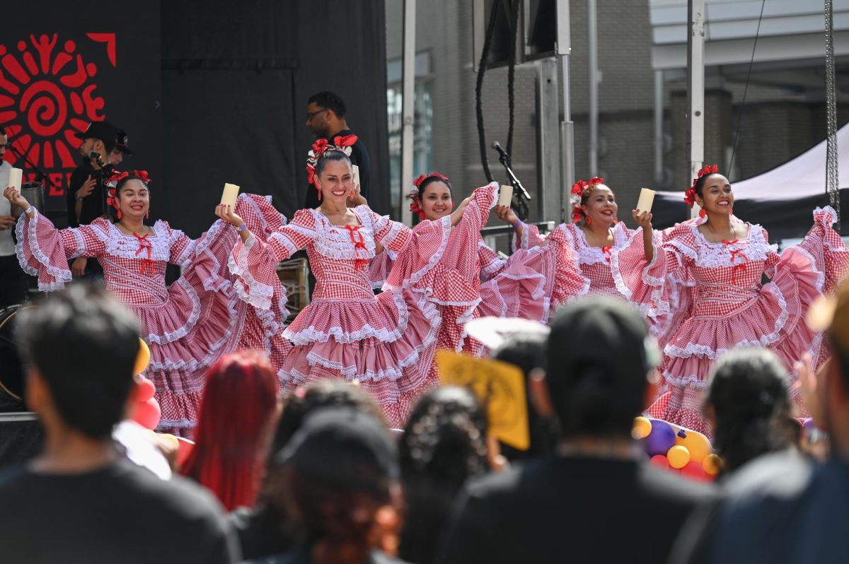 Colombian dance group Cumbión Colombiano perform on stage during La Fiesta del Pueblo at Fayetteville Street Historic District on Sunday, Sept. 21, 2025. The event, which draws thousands annually, is organized by El Pueblo to celebrate the pride and resilience of the Latine community.