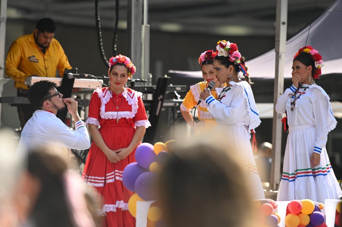 Honduran folklórico dance group Colibrí Esmeralda perform on stage during La Fiesta del Pueblo at Fayetteville Street Historic District on Sunday, Sept. 21, 2025. The event, which draws thousands annually, is organized by El Pueblo to celebrate the pride and resilience of the Latine community.