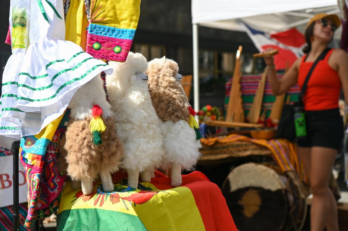 Plush llama toys sit on display at the Bolivian table during La Fiesta del Pueblo at Fayetteville Street Historic District on Sunday, Sept. 21, 2025. The event, which draws thousands annually, is organized by El Pueblo to celebrate the pride and resilience of the Latine community.