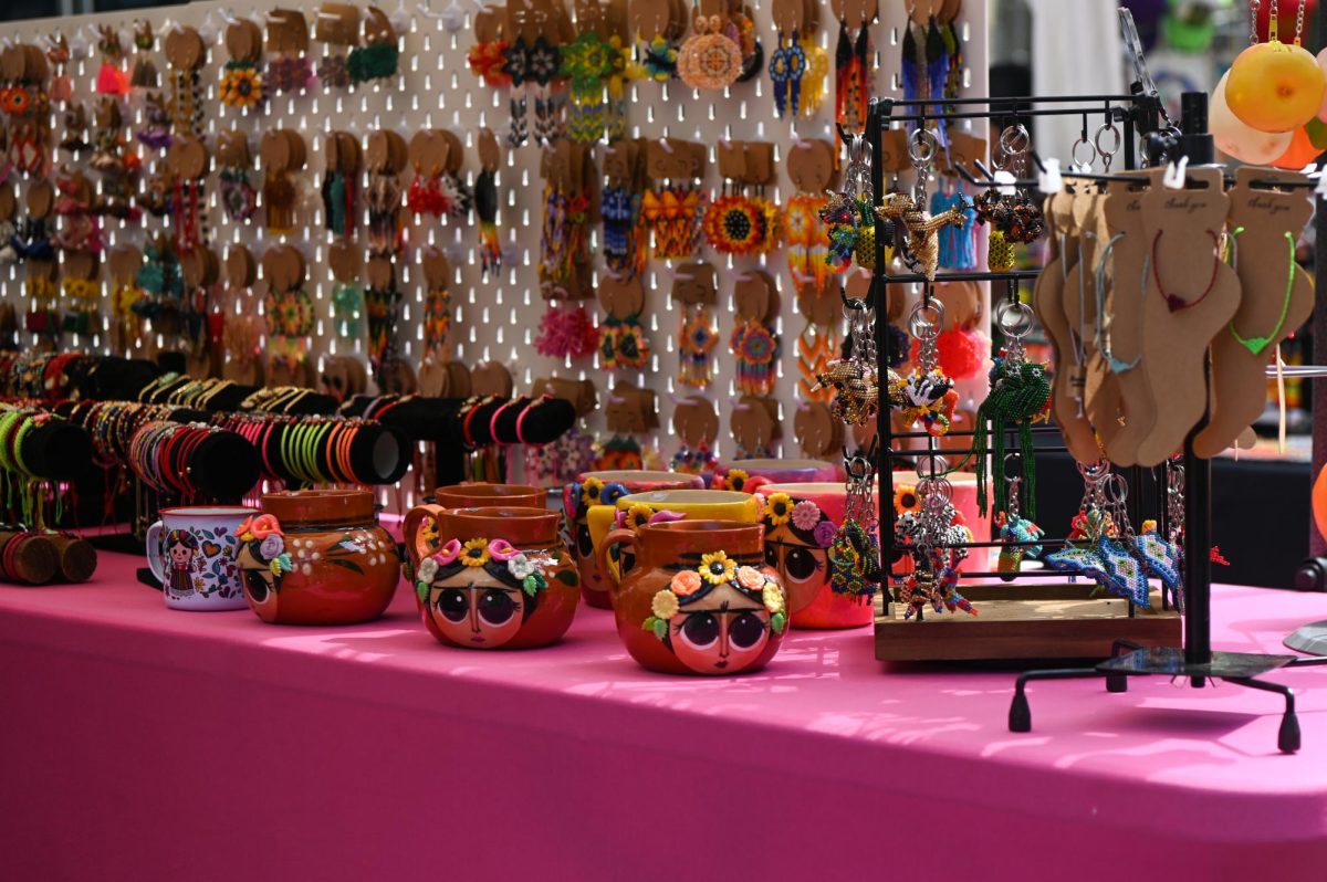 Mexican decorative pieces line a vendor’s table for sale during La Fiesta del Pueblo at Fayetteville Street Historic District on Sunday, Sept. 21, 2025. The event, which draws thousands annually, is organized by El Pueblo to celebrate the pride and resilience of the Latine community.
