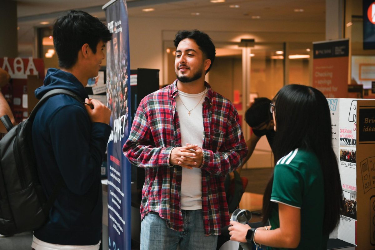 Mateo De La Rocha, a second-year studying finance, Jason Lopez Villanueva, a fourth-year studying accounting and business analytics, and Andrea Ramos-Olea, a second-year studying accounting, share a conversation during the Latinx Heritage Month Kick-off in Talley Student Union on Monday, Sept. 15, 2025. Organized by Multicultural Student Affairs, the event showcased the different latin and Hispanic organizations on campus and provided students with a list of upcoming events to celebrate the Heritage Month.