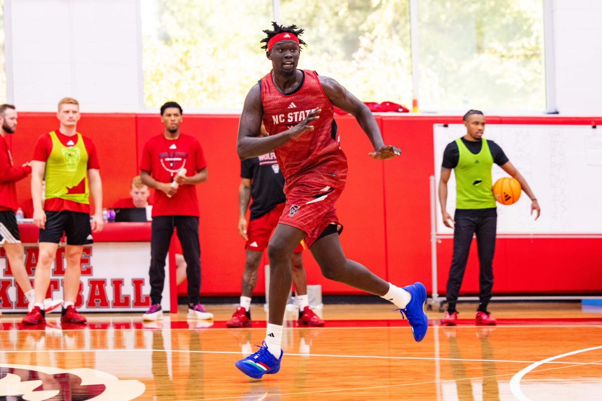 Junior forward Jerry Deng runs during a drill during the first official practice of the 2025-2026 season on Monday, Sept. 22, 2025, inside the Dail Basketball Center. The event gave reporters a chance to watch the Wolfpack up close as the team prepared for the upcoming season.