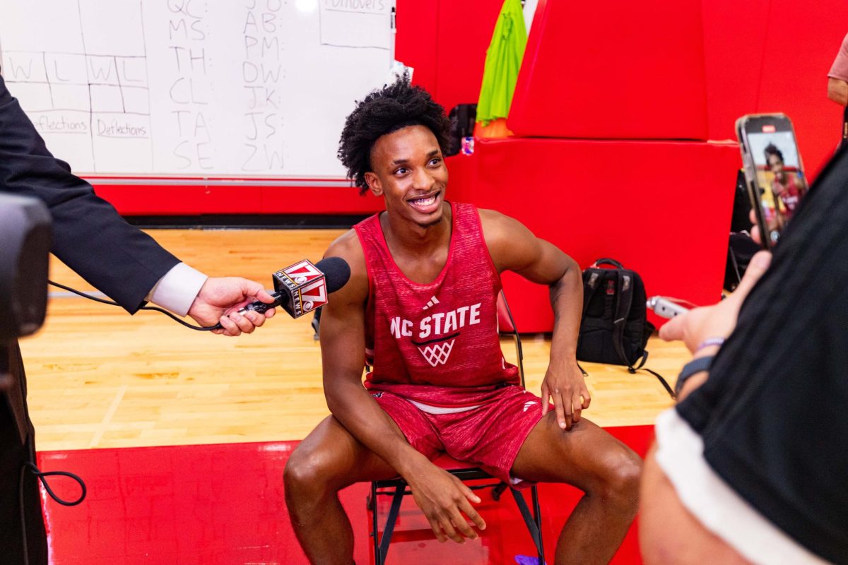 Sophomore guard Paul McNeil smiles while speaking to a reporter before the first official practice of the 2025-2026 season on Monday, Sept. 22, 2025, inside the Dail Basketball Center. The annual media availability marked the start of another Wolfpack basketball season.