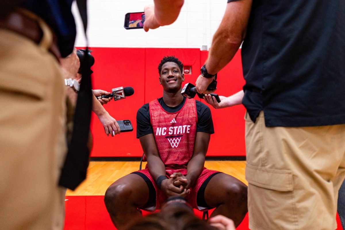 Freshman forward Musa Sagnia smiles while speaking to the media before the first official practice of the 2025-2026 season on Monday, Sept. 22, 2025, inside the Dail Basketball Center. The event gave reporters a chance to watch the Wolfpack up close as the team prepared for the upcoming season.