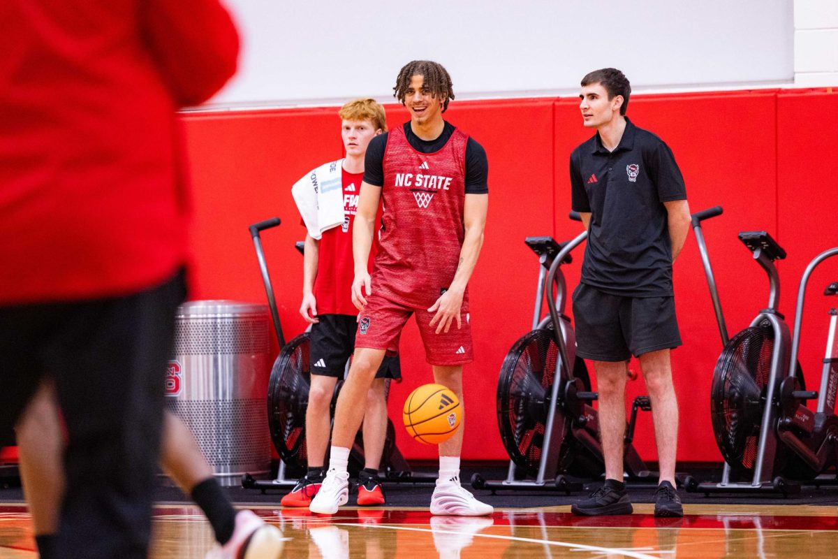 Senior guard Jordan Snell smiles while dribbling the ball during the first official practice of the 2025-2026 season on Monday, Sept. 22, 2025, inside the Dail Basketball Center. The Men’s Basketball program hosted the media for 30 minutes before practice inside the Dail Basketball Center.