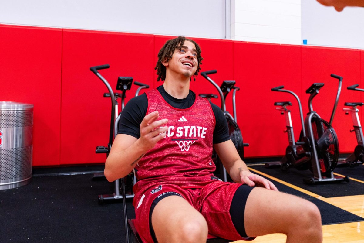 Senior guard Jordan Snell laughs while speaking to a reporter before the first official practice of the 2025-2026 season on Monday, Sept. 22, 2025, inside the Dail Basketball Center. The annual media availability marked the start of another Wolfpack basketball season.