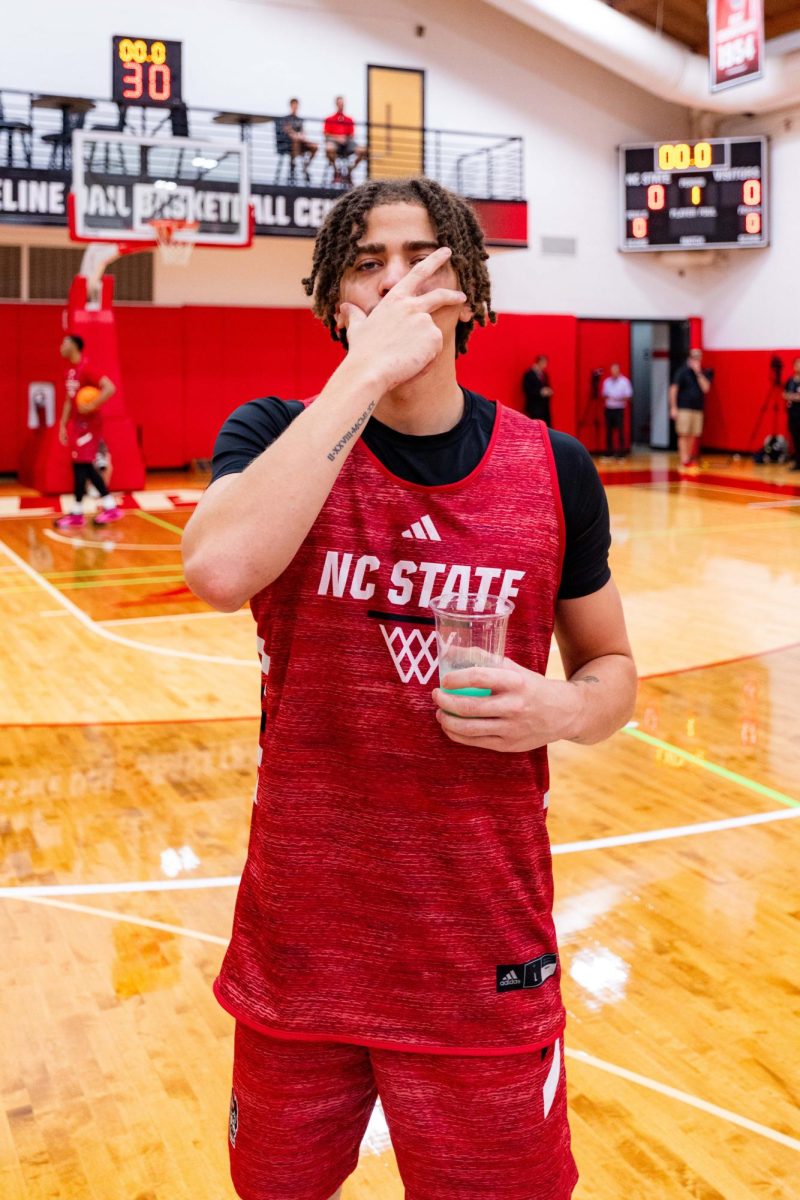 Senior guard Jordan Snell poses doing a three-point celebration before the first official practice of the 2025-2026 season on Monday, Sept. 22, 2025, inside the Dail Basketball Center. The annual media availability marked the start of another Wolfpack basketball season.