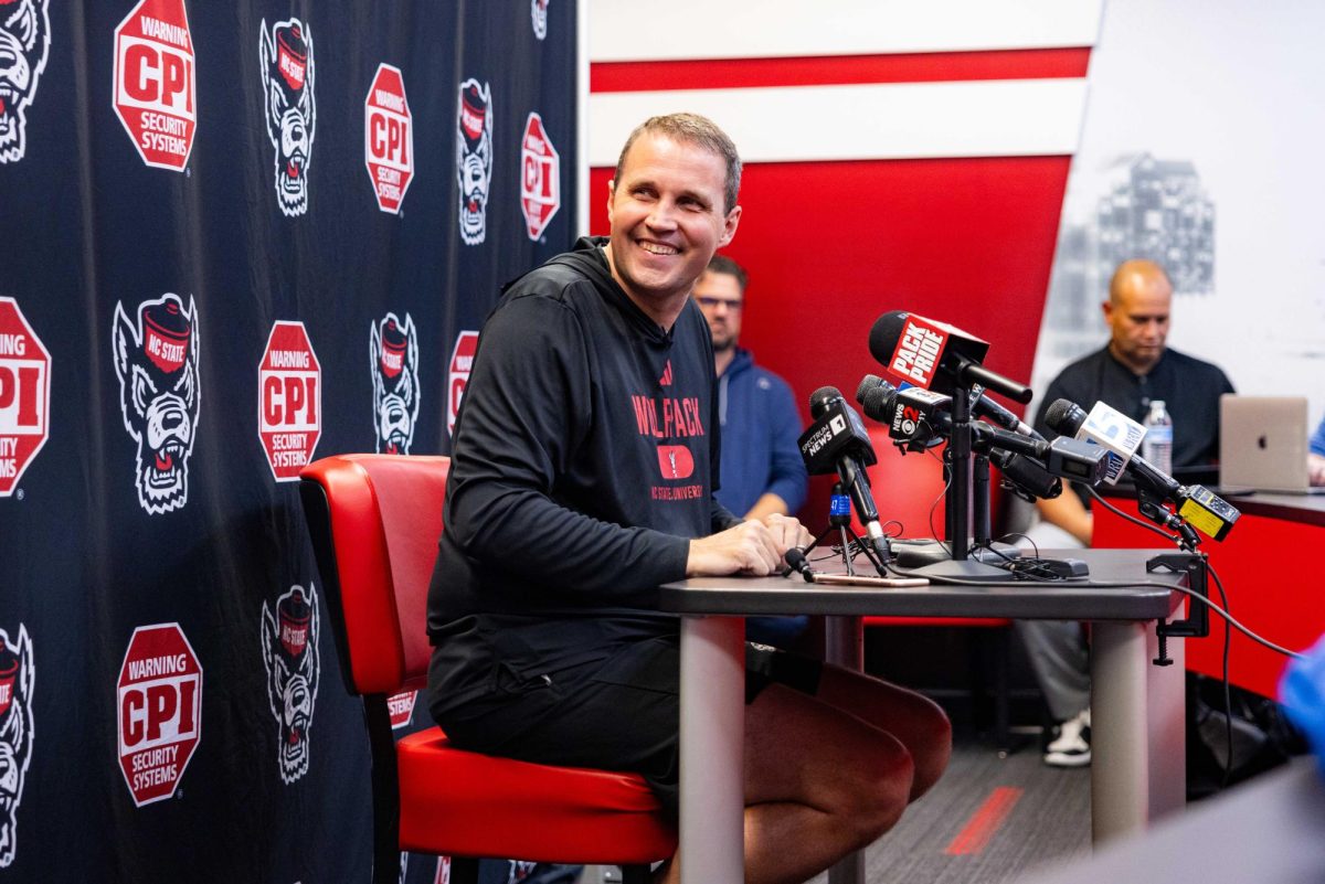 Will Wade, Head Coach of the NC State Men’s Basketball team, smiles after hearing a question from a reporter during his press conference inside the Dail Basketball Center on Monday, Sept. 22, 2025. The media session introduced Wade’s vision for the upcoming season and allowed reporters to ask questions about the team’s preparation.