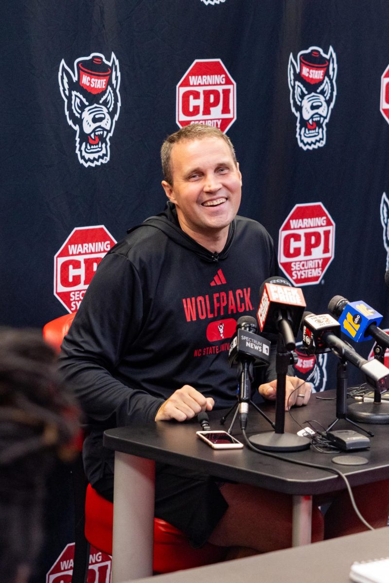 Will Wade, Head Coach of the NC State Men’s Basketball team, laughs while speaking to a reporter in attendance during his press conference inside the Dail Basketball Center on Monday, Sept. 22, 2025. Wade spoke about the “Red Reckoning,” a rallying call he hopes will define the Wolfpack’s identity this season.