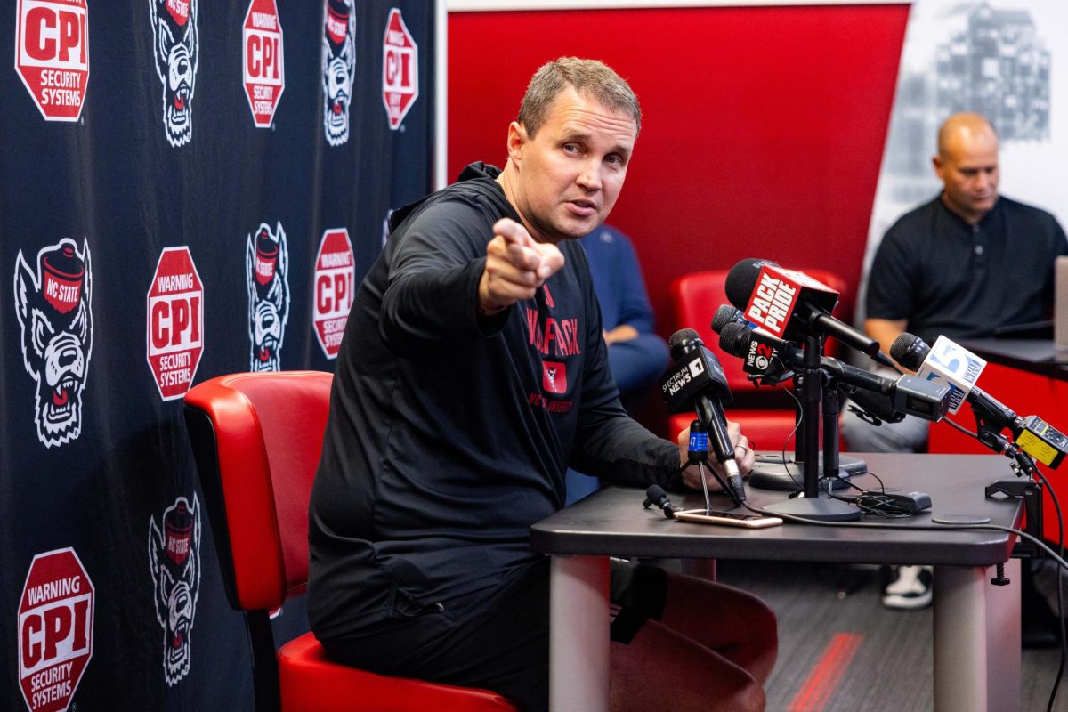 Will Wade, Head Coach of the NC State Men’s Basketball team, points at a reporter who asked a question during his press conference inside the Dail Basketball Center on Monday, Sept. 22, 2025. Wade spoke on the theme of “Red Reckoning,” a mantra meant to fire up both players and fans heading into the new campaign.