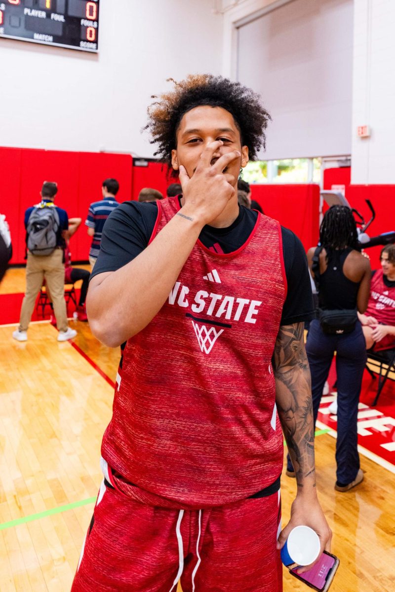 Senior forward Darrion Williams poses doing a three-point celebration before the first official practice of the 2025-2026 season on Monday, Sept. 22, 2025, inside the Dail Basketball Center. The annual media availability marked the start of another Wolfpack basketball season.