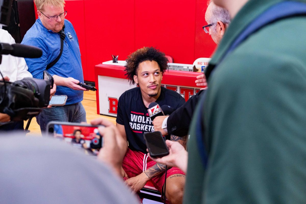 Senior forward Darrion Williams smirks while listening to a reporter ask a question before the first official practice of the 2025-2026 season on Monday, Sept. 22, 2025, inside the Dail Basketball Center. The annual media availability marked the start of another Wolfpack basketball season.