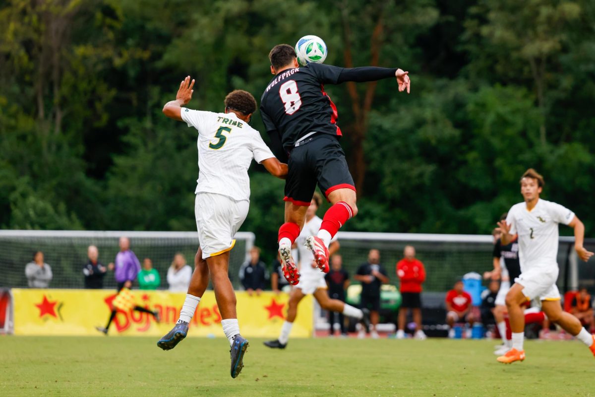 Senior midfielder Justin McLean jumps for a header during the game against William & Mary University at Dail Soccer Field on Tuesday, Sep. 16, 2025. McLean had one shot on the goal. NC State beat W&M 7-0.