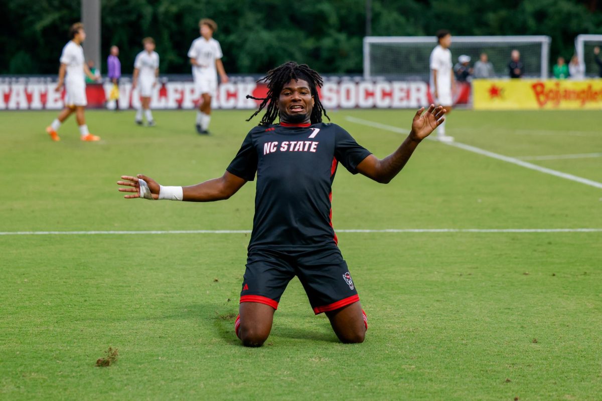 Junior forward Donavan Phillip slides after scoring his 4th goal during the game against William & Mary University at Dail Soccer Field on Tuesday, Sep. 16, 2025. Phillip scored four goals in 28 minutes. NC State beat W&M 7-0.