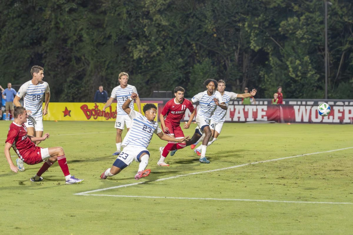 Redshirt junior forward Aidan Payne shoots the ball during the men's soccer match against UNC-Chapel Hill at Dail Soccer Field on Friday, Sept. 5, 2025. Payne had one shot on goal. NC State tied with UNC 0-0.