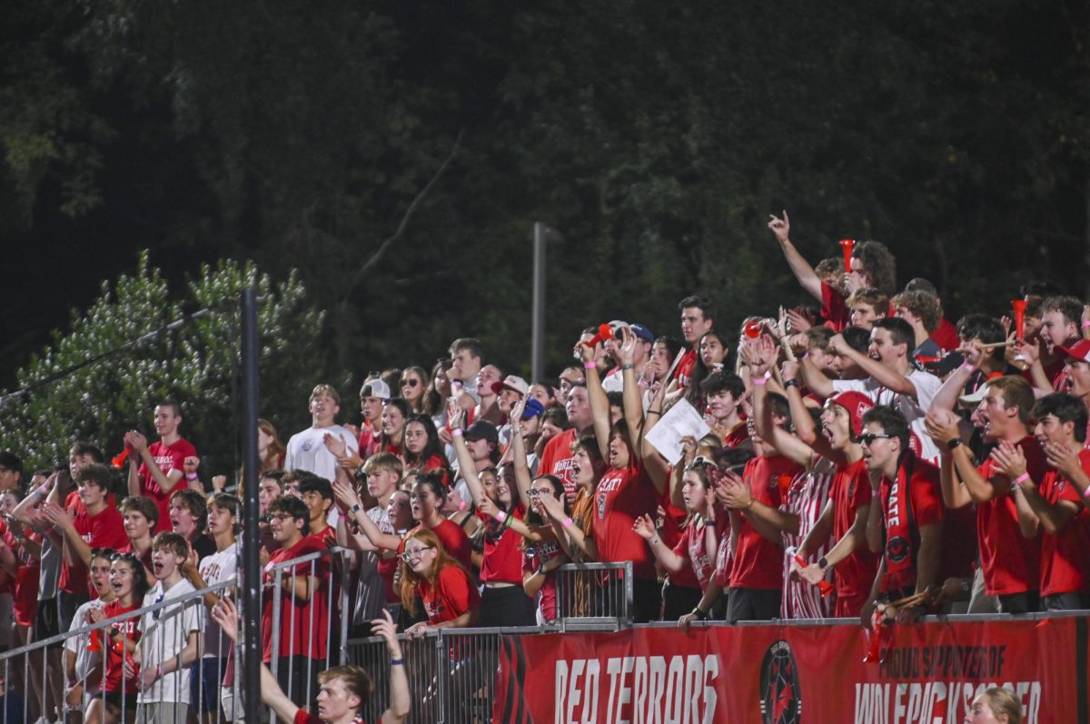 NC State fans cheer during the soccer match against UNC-Chapel Hill at Dail Soccer Field on Friday, Sept. 5, 2025. This game broke the attendance record with over 4,000 attendees being in the stadium. NC State tied with UNC 0-0.