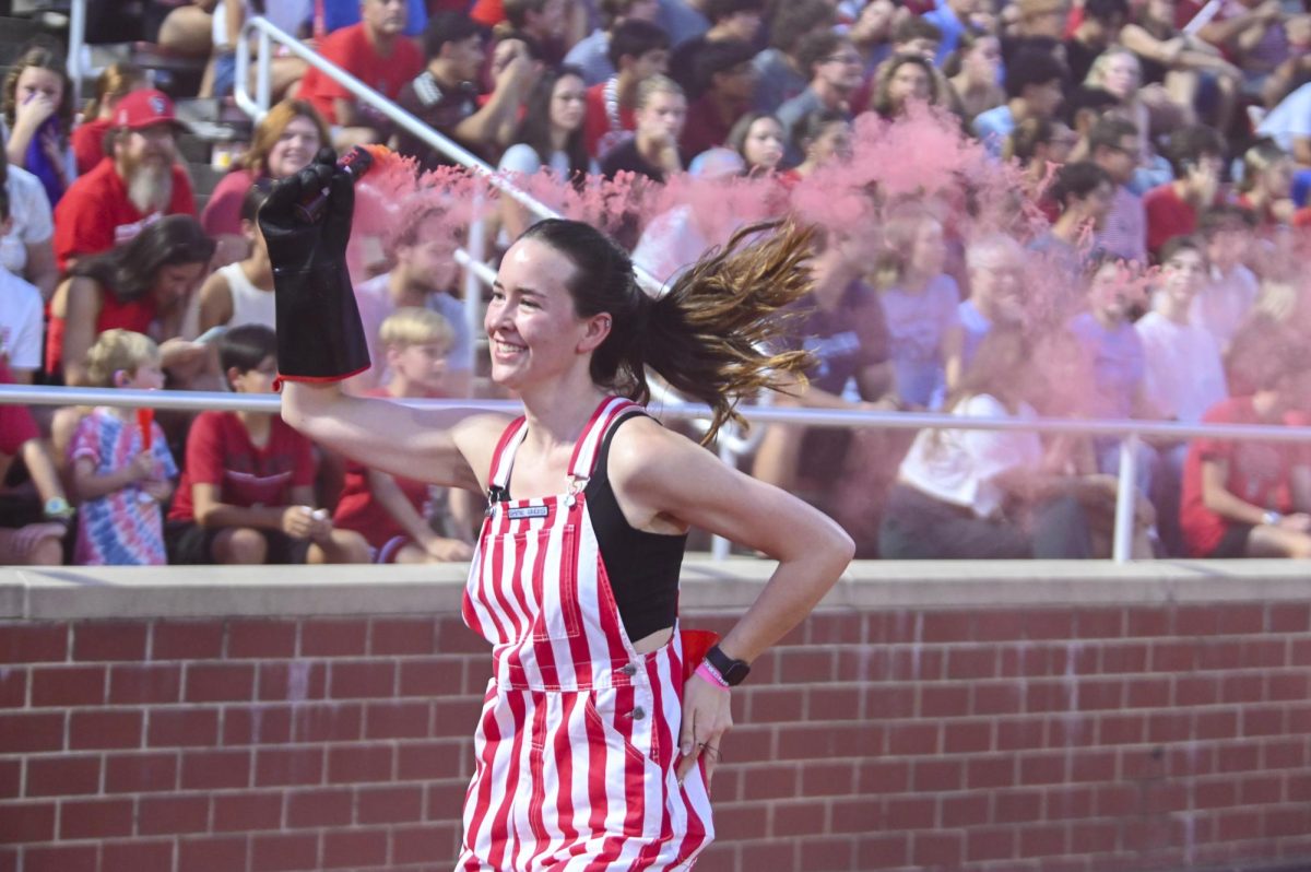 Sarah Grembecki, a third-year studying accounting, runs with the fogger during the soccer match against UNC-Chapel Hill at Dail Soccer Field on Friday, Sept. 5, 2025. This game broke the attendance record with over 4,000 attendees being in the stadium. NC State tied with UNC 0-0.
