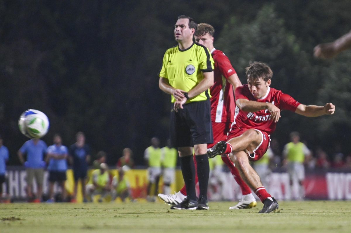 Senior midfielder Taig Healy kicks the ball during the soccer match against UNC-Chapel Hill at Dail Soccer Field on Friday, Sept. 5, 2025. Healy made seven shots and three shots on goal. NC State tied with UNC 0-0.