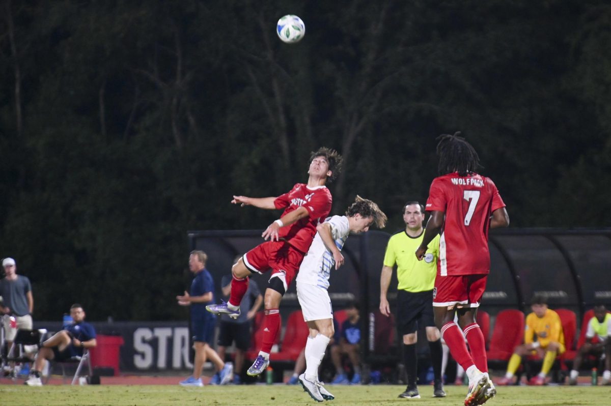 Fifth-year midfielder Max Ogawa hits the ball with his head during the soccer match against UNC-Chapel Hill at Dail Soccer Field on Friday, Sept. 5, 2025. This game broke the attendance record with over 4,000 attendees being in the stadium. NC State tied with UNC 0-0.