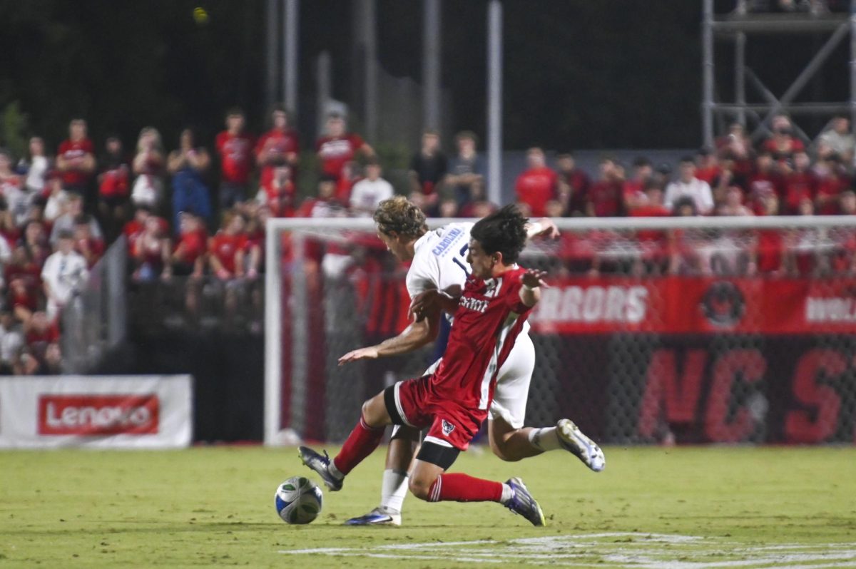 Fifth-year midfielder Max Ogawa kicks the ball away from his opponent during the soccer match against UNC-Chapel Hill at Dail Soccer Field on Friday, Sept. 5, 2025. Ogawa made two shots. NC State tied with UNC 0-0.
