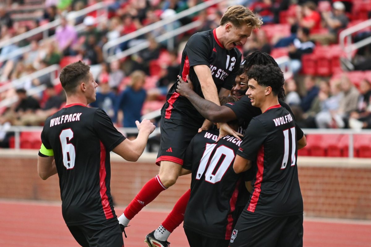 NC State celebrates as a team after scoring a goal during the match against William & Mary at Dail Soccer Stadium on Tuesday, Sept 16, 2025. The Wolfpack scored four goals in the first half and three goals in the second half. NC State beat William & Mary 7-0.