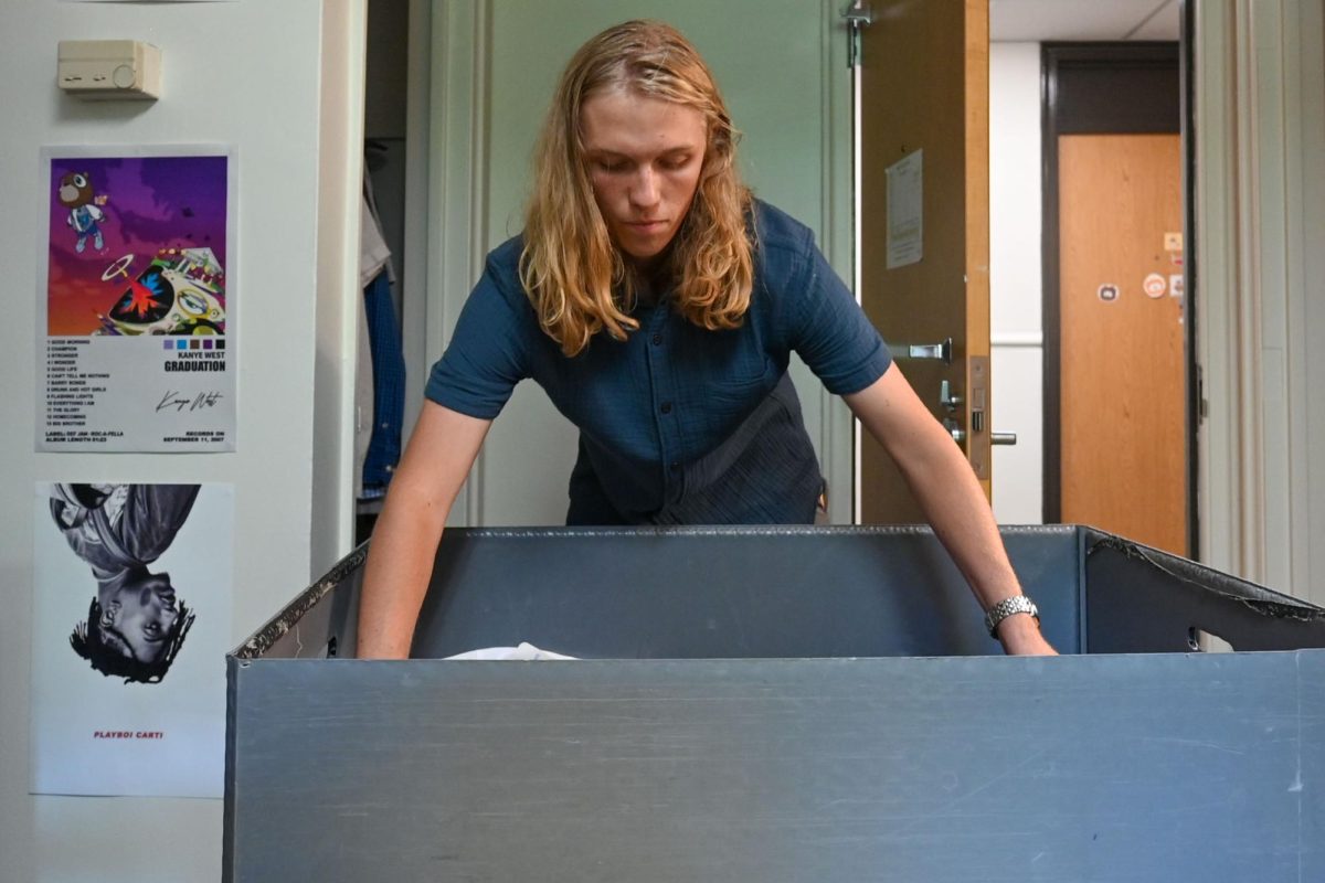 Ford Stewart, a first-year in exploratory studies, begins to unpack in his dorm room in Owen Residence Hall during move-in day Aug. 16. Move-in begins the Thursday before classes start.