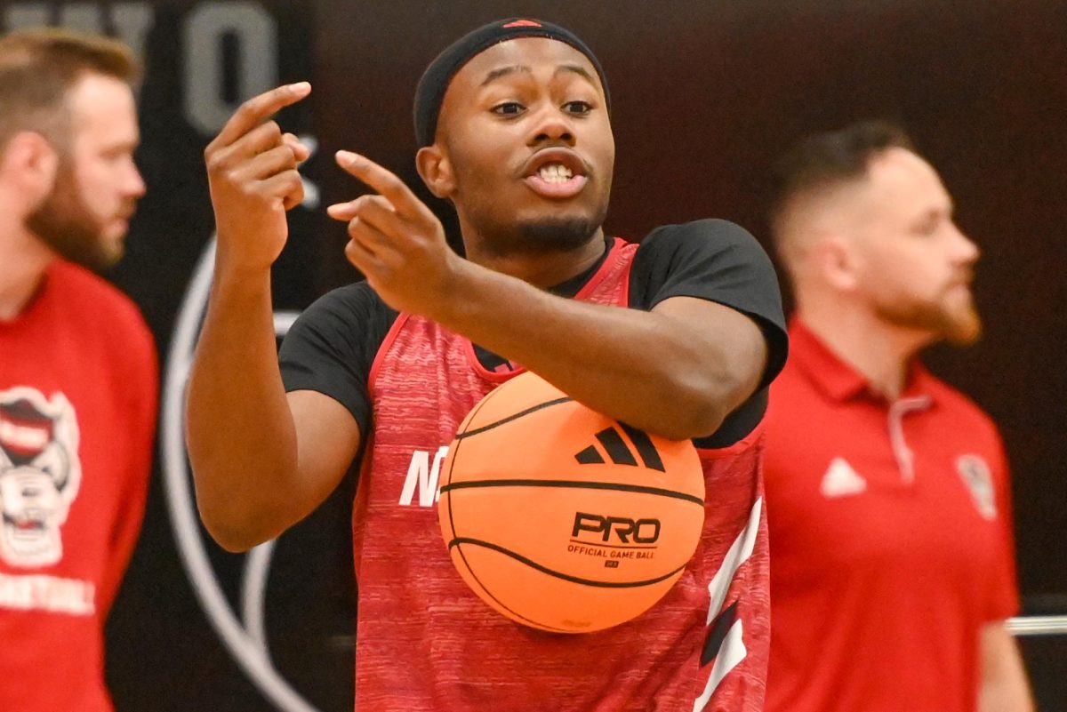 Senior guard Tre Holloman signals to his teammates during the open media practice inside the Dail Center on Monday, Sept. 22, 2025. The men’s basketball program hosted the media for the first 30 minutes of its first official practice for the 2025-26 basketball season.