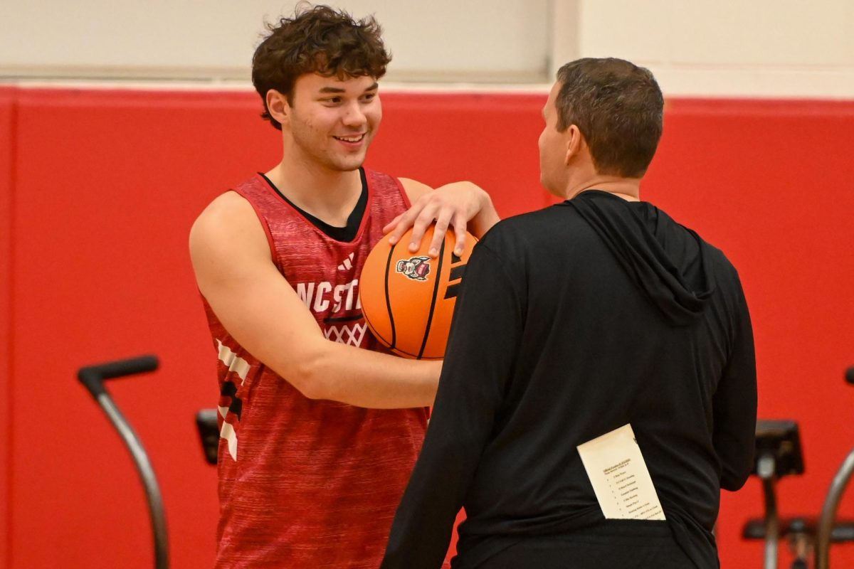 Redshirt freshman forward Colt Langdon talks to head coach Will Wade before the open media practice inside the Dail Center on Monday, Sept. 22, 2025. The men’s basketball program hosted the media for the first 30 minutes of its first official practice for the 2025-26 basketball season.