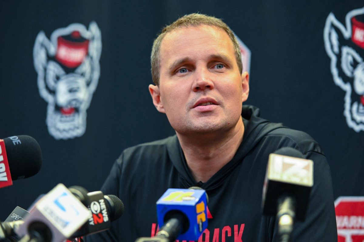 Will Wade, head coach of NC State men’s basketball, listens to a reporter in the audience during his press conference inside the Dail Center on Monday, Sept. 22, 2025.   