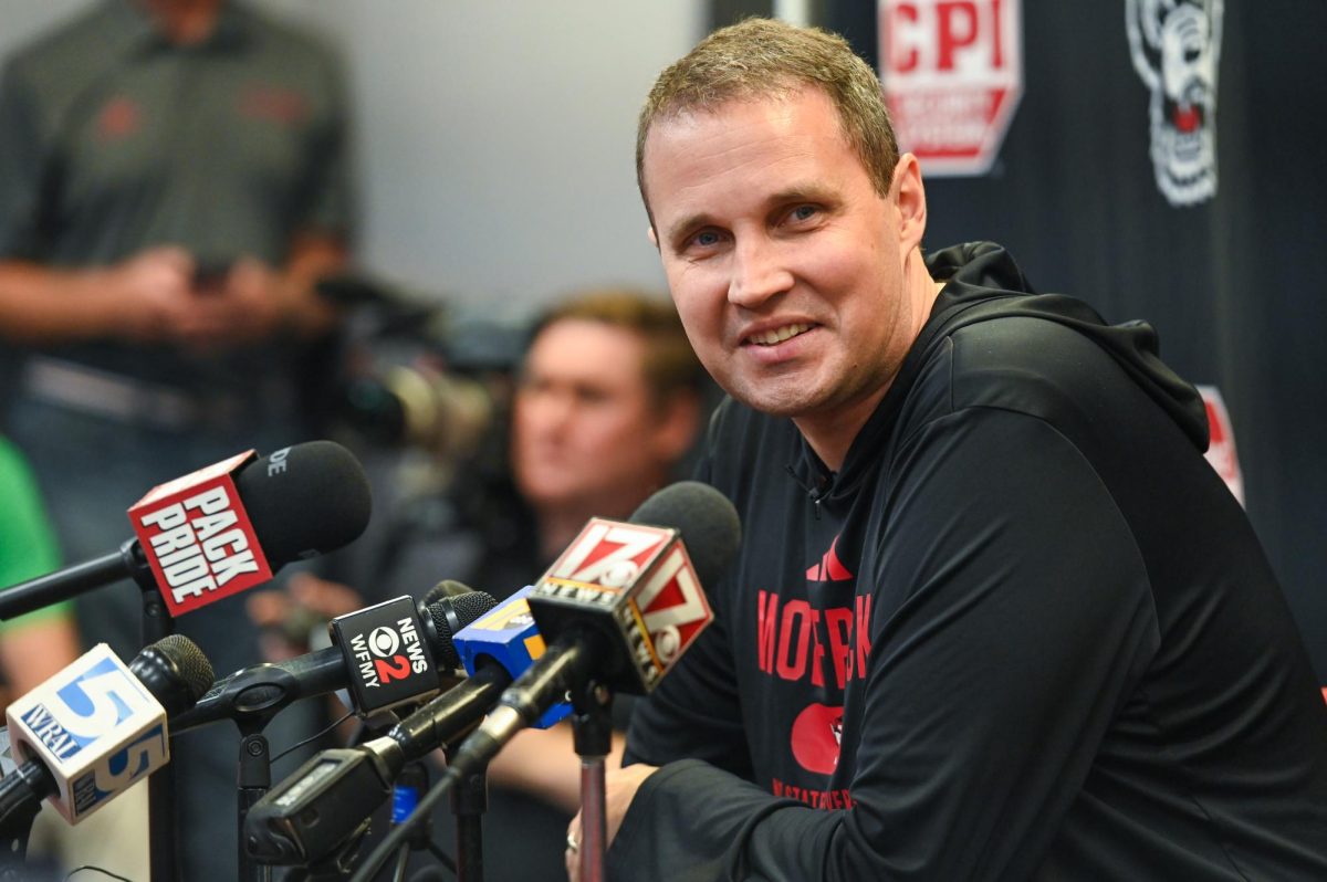 Will Wade, head coach of NC State men’s basketball, smiles at a reporter in the audience during his press conference inside the Dail Center on Monday, Sept. 22, 2025.   
