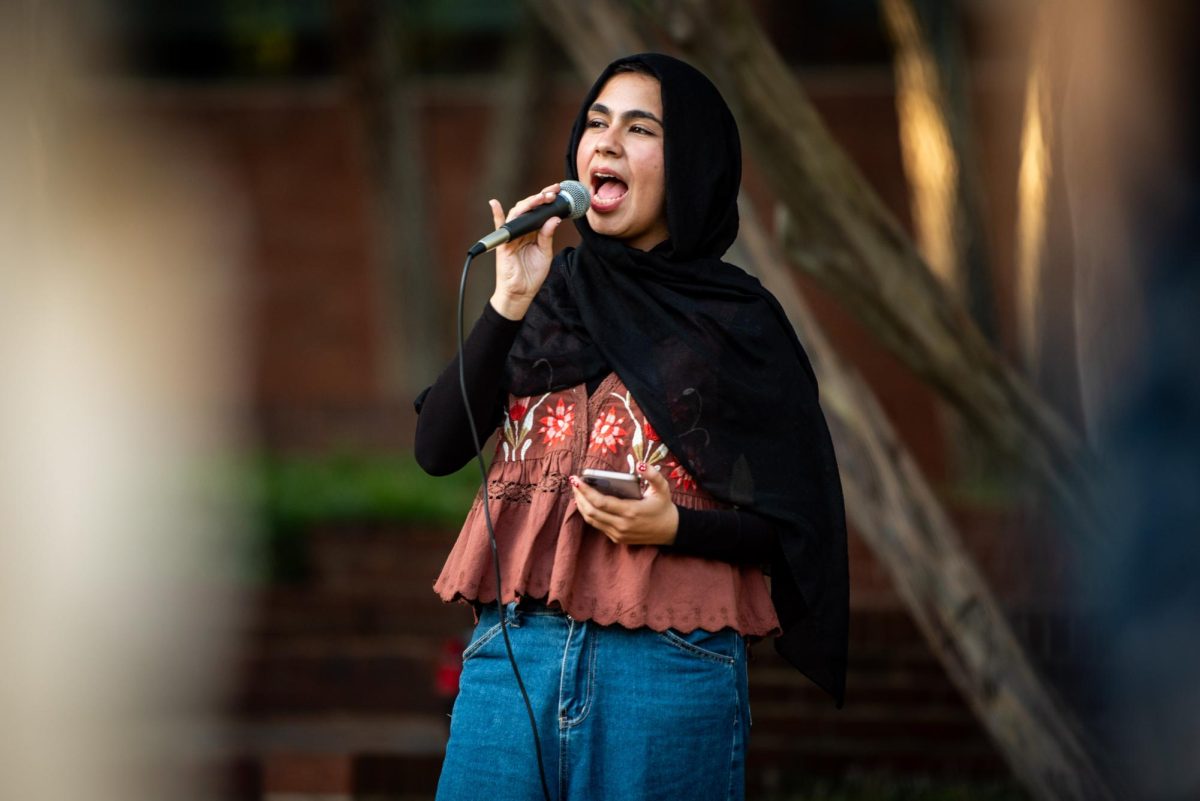 A member of NCSU Students for Justice in Palestine, who declined to give their name, leads a chant during the "There is no Back to School in Gaza" protest in the Court of North Carolina on Monday, Sept. 8, 2025. The Group honored students in Gaza and the West Bank with a series of chants and speeches.