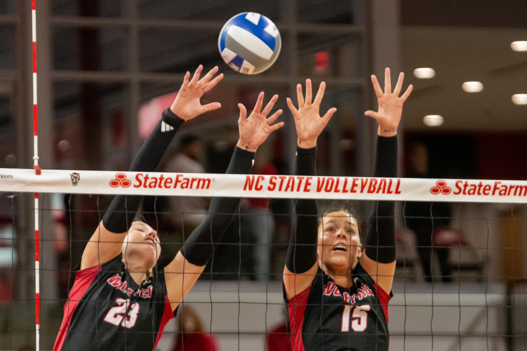Freshman opposite Jordan Smith and senior middle blocker Lily Cropper reach to block a spike during the match against Cleveland State in Reynolds Coliseum on Saturday, Sept. 13, 2025. The Wolfpack defeated the Vikings 3-0.