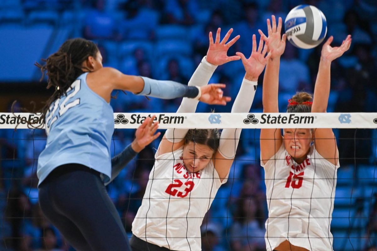 Freshman opposite hitter Jordan Smith and senior middle blocker Lily Cropper block the oncoming spike during the game against UNC-Chapel Hill on Sunday, Sept. 28, 2025. Smith and Cropper combined for 15 kills. NC State fell to UNC-Chapel Hill 3-1.