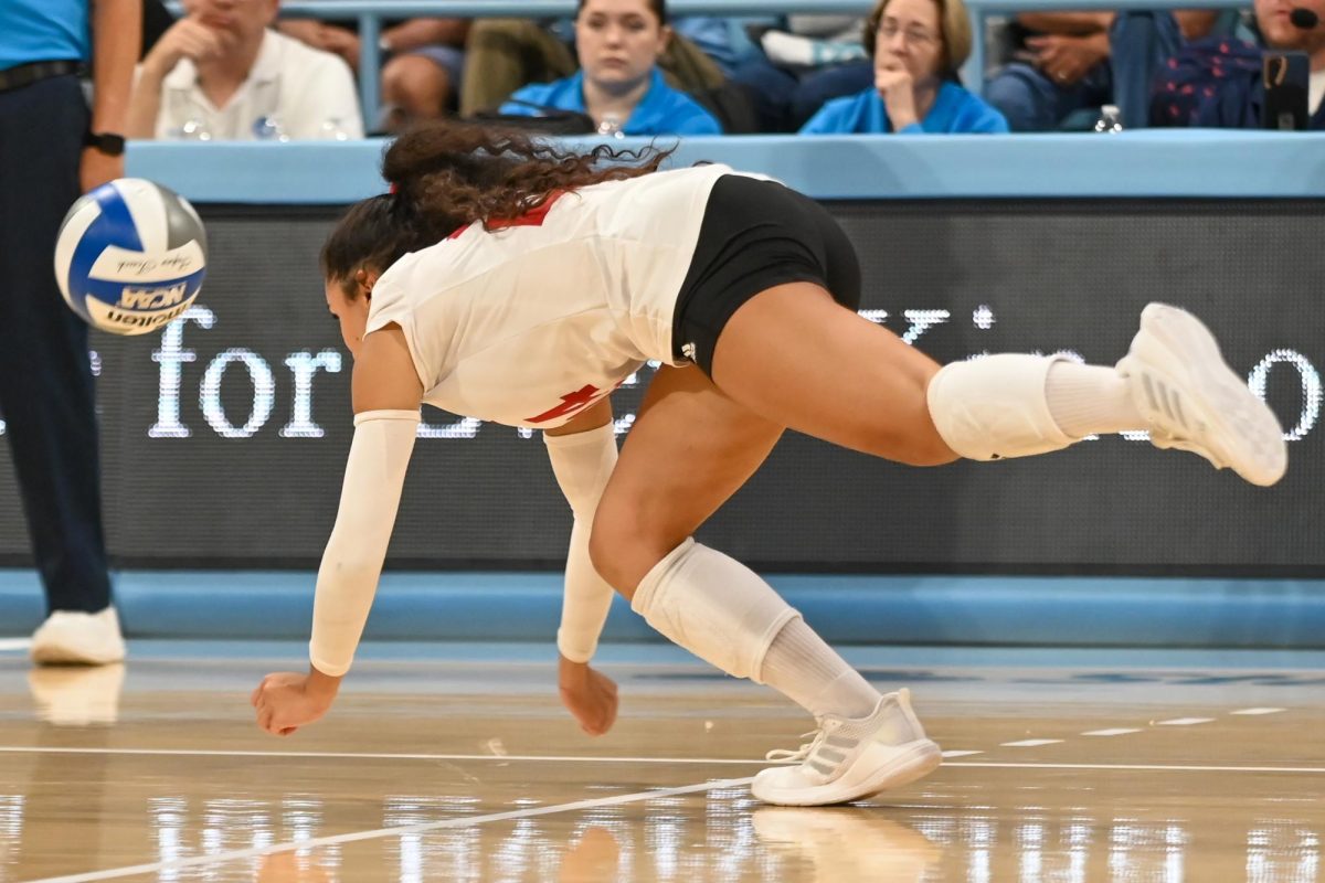 Senior defensive specialist Sydney Daniels dives after the ball during the game against UNC-Chapel Hill on Sunday, Sept. 28, 2025. NC State fell to UNC-Chapel Hill 3-1.