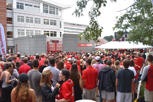 Students wait in front of the gate to enter Carter-Finley Stadium on Thursday, Sept. 1, 2016.  Security at Carter Finely has since increased security measures and ticket policies that have affected students. 