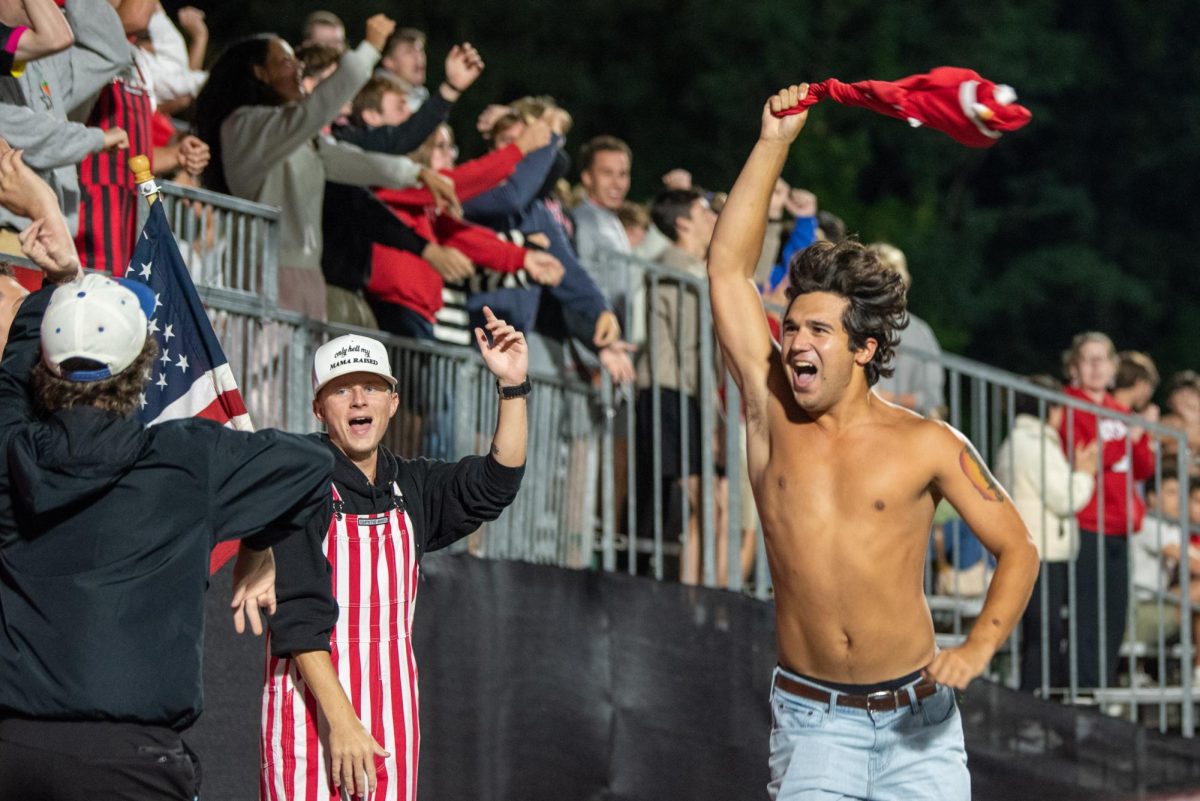 Caleb Huff, a third year in biology, swings his shirt around in celebration of a goal during the game against Campbell in Dail Soccer Stadium on Sunday, Sept. 7, 2025. The Wolfpack defeated the Camels 4-0.