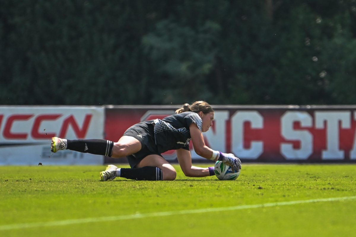 Senior goalkeeper Olivia Pratapas pounces on the ball during the game against Florida State in Dail Soccer Stadium on Sunday Sept. 21, 2025. NC State tied Florida State 1-1.